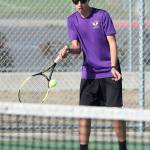 Ridgely Briddell returns a shot in first doubles.(Photo by John Fisken)