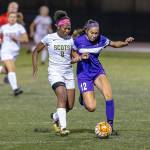 Oak Harbors Mikhaela Cortez (12) battles Shorecrests Amanda Kagarabi for possession. (Photo by John Fisken)