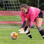 Sarah Wright scoops up the ball for Coupeville.(Photo by John Fisken)