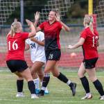 Avalon Renninger (16), Lindsey Roberts (18) and Audrianna Shaw (17) celebrate a Coupeville goal. (Photo by John Fisken)