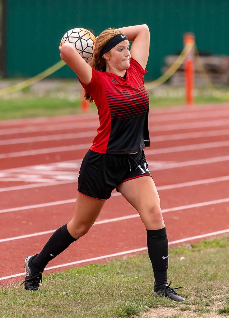 Ema Smith tosses the ball in play Thursday.(Photo by John Fisken)
