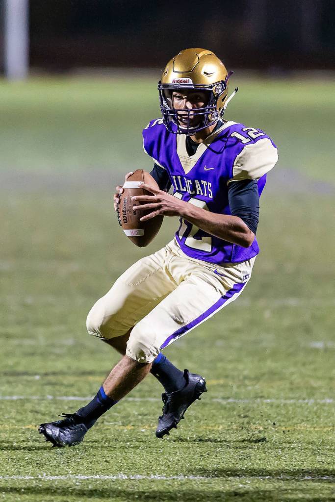 Caleb Fitzgerald looks for an open receiver in Fridays win.(Photo by John Fisken)
