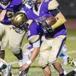 Caden Leckelt looks for some running room on the way to a game-high 141 rushing yards.(Photo by John Fisken)