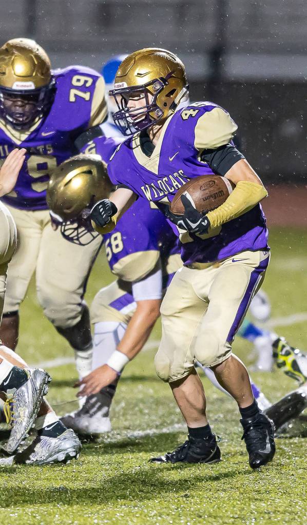 Caden Leckelt looks for some running room on the way to a game-high 141 rushing yards.(Photo by John Fisken)