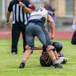Sean Toomey-Stout snags a Friday Harbor ball carrier.(Photo by John Fisken)