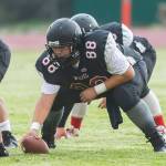 Isaiah Bittner prepares to hike the ball for the Wolves. (Photo by John Fisken)