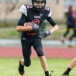 Xavier Murdy picks up some yardage for Coupeville.(Photo by John Fisken)