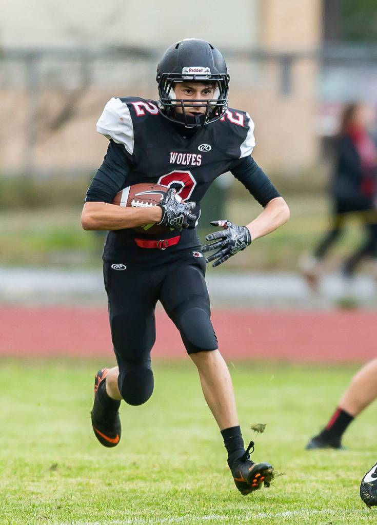Xavier Murdy picks up some yardage for Coupeville.(Photo by John Fisken)