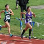 Oak Harbors Alex Smith, right, sprints to the finish ahead of Jacksons Allyson Kim in the Westling Invitational. (Photo by Jim Waller/Whidbey News-Times)