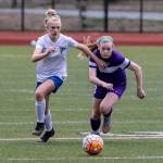 Oak Harbors Alexandra Palmer, right, races South Whidbeys Mikenna Wicher to the ball.(Photo by John Fisken)