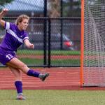 Natalie Plush boots the ball for the Wildcats.(Photo by John Fisken)