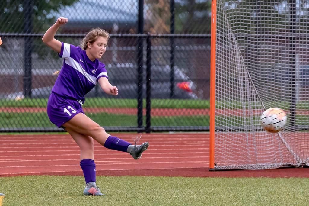 Natalie Plush boots the ball for the Wildcats.(Photo by John Fisken)