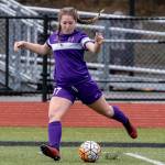 Peyton Rhyne punches the ball up field.(Photo by John Fisken)