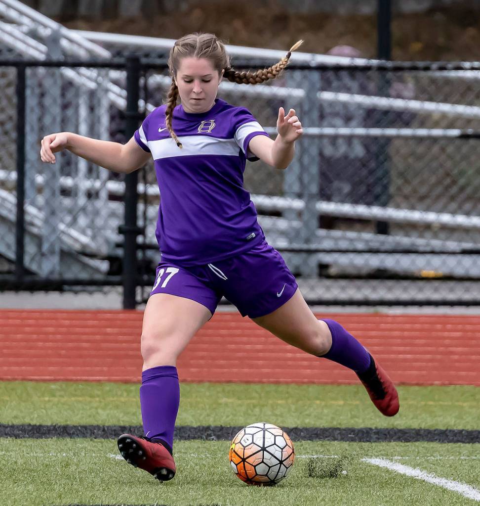 Peyton Rhyne punches the ball up field.(Photo by John Fisken)