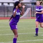 Jessica Vester uses her head to control the ball for the Wildcats.(Photo by John Fisken)