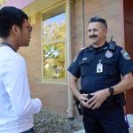 Officer Jim Hoagland talks to senior Alfonso Alfonso out side of Oak Harbor High School. Hoagland is the new student resource office for the Oak Harbor School District. Photo by Laura Guido/Whidbey News-Times