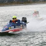 A hydroplane driver returns the pits, waving to the crowd on his way in Sunday..                                Photo by Jim Waller/Whidbey News-Times