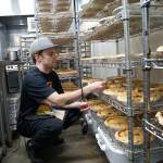 Photo by Maria Matson/Whidbey News-Times.                                Jordan Henriot checks the temperature on individual pies, ensuring that they cool to the proper temperature.
