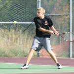 Drake Borden slaps a backhand in his win in second singles. (Photo by John Fisken)