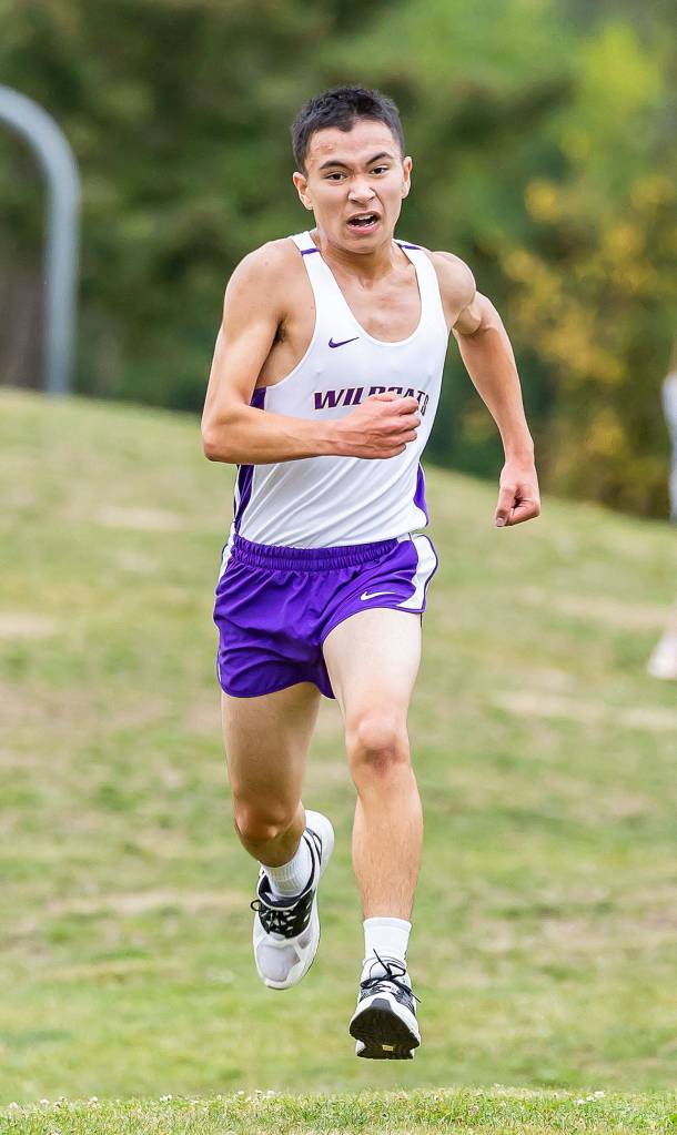 Ralph Ramier heads to the finish line in 15th place, second among Oak Harbor boys.(Photo by John Fisken)