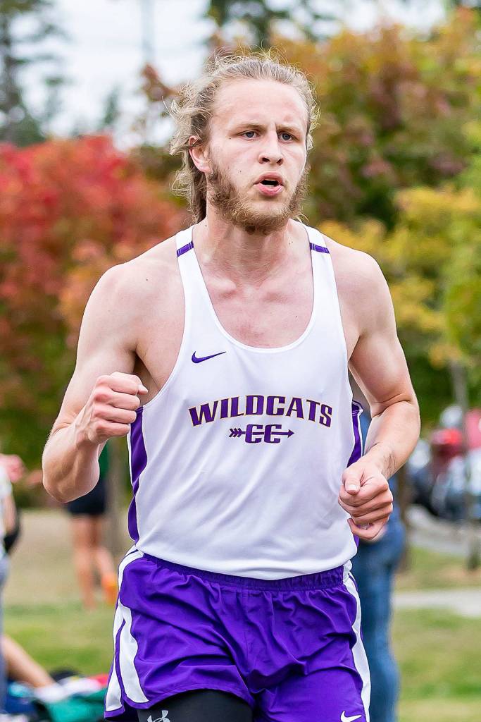 Josh Stone crosses the finish line for Oak Harbor.(Photo by John Fisken)