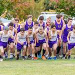The Oak Harbor boys take off at the beginning of Thursdays race. Dallas Riddle-Stevens, far left in the cap, finished first out of 64 runners. (Photo by John Fisken)