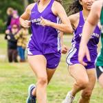 Evelyn Osburn, left, and Stephanie Flores were the third and fourth Oak Harbor female runners to finish.(Photo by John Fisken)