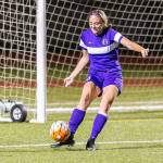 Traci Miller-Olmstead puts the ball in play Thursday.(Photo by John Fisken)