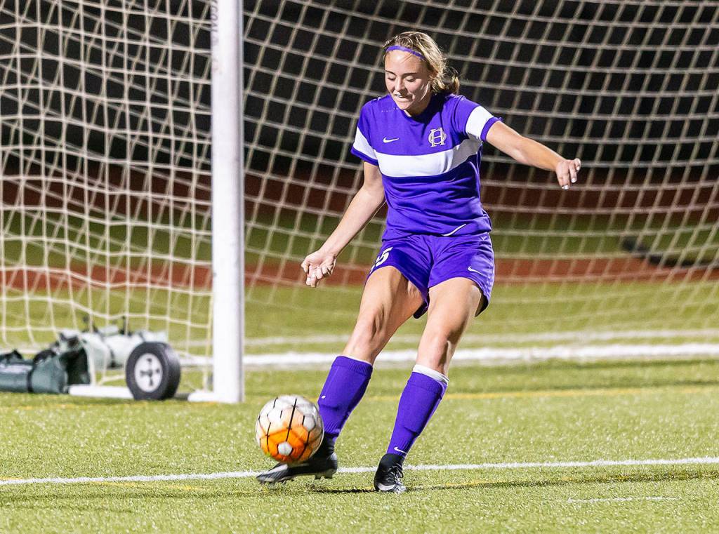 Traci Miller-Olmstead puts the ball in play Thursday.(Photo by John Fisken)