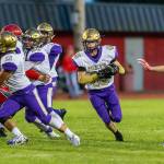 Caden Leckelt (45) runs through a huge hole created by a wall of blockers, including Aaron Martinez (11) and Brandon McCollough (58).(Photo by John Fisken)
