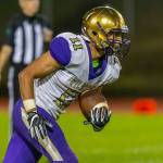 Aaron Martinez returns a kick for Oak Harbor.(Photo by John Fisken)