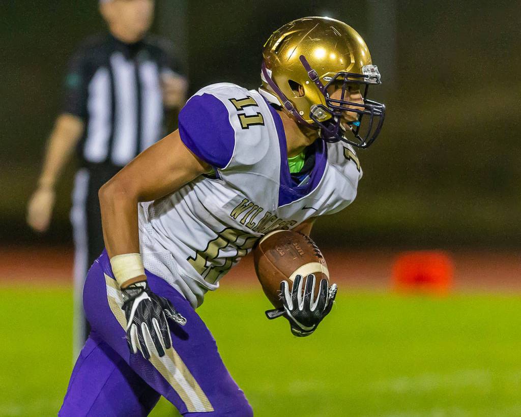 Aaron Martinez returns a kick for Oak Harbor.(Photo by John Fisken)