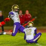 Jake Mitten kicks an extra point out of the hold of Caleb Fitzgerald.(Photo by John Fisken)