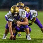 Nathaneil Nunez prepares to hike to Caleb Fitzgerald as Caden Leckelt waits in the Wildcat backfield.(Photo by John Fisken)