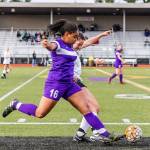Oak Harbors Tiana Jackson (16) beats a Marysville Getchell player to the ball in Saturdays match. Jackson tallied two goals in the Wildcats 4-1 win.(Photo by John Fisken)