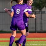 Peyton Rhyne (8) celebrates with Gracie Hiteshew after Hiteshews goal give Oak Harbor the lead.(Photo by John Fisken)