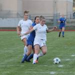 Coupevilles Natalie Hollrigel (10) shields South Whidbeys Alison Papritz from the ball. (Photo by Jim Waller/Whidbey News-Times)