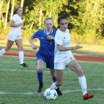 Mallory Kortuem beats a South Whidbey player to the ball.(Photo by Jim Waller/Whidbey News-Times)