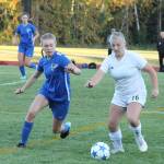 Coupevilles Avalon Renninger (16) and South Whidbeys Julian Larson close in on the ball.(Photo by Jim Waller/Whidbey News-Times)
