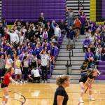 The Oak Harbor fans signal one more point as the Wildcats serve game point in the second set Tuesday. (Photo by John Fisken)