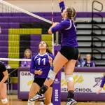 After receiving a set from Leah Quidachay (11), Payton Parks goes on the attack for Oak Harbor.(Photo by John Fisken)