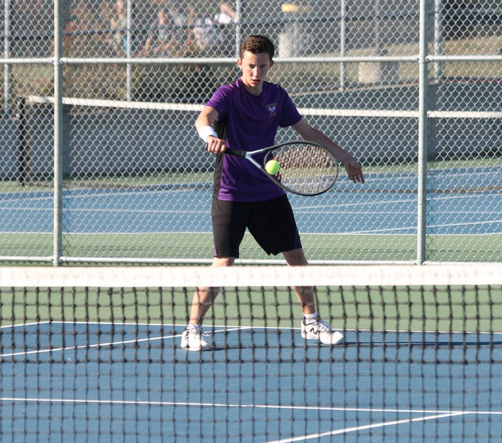 Nathaniel Thompson flips a backhand in second singles.(Photo by Jim Waller/Whidbey News-Times)