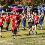 The North Whidbey seventh-grade boys (red shirts) take off from the start line Wednesday. Seven Cougars finished among the top eight.(Photo by John Fisken)