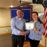 Photo provided                                Kaitlin Barrailler of Oak Harbor High School and President Todd Krantz with certificate.