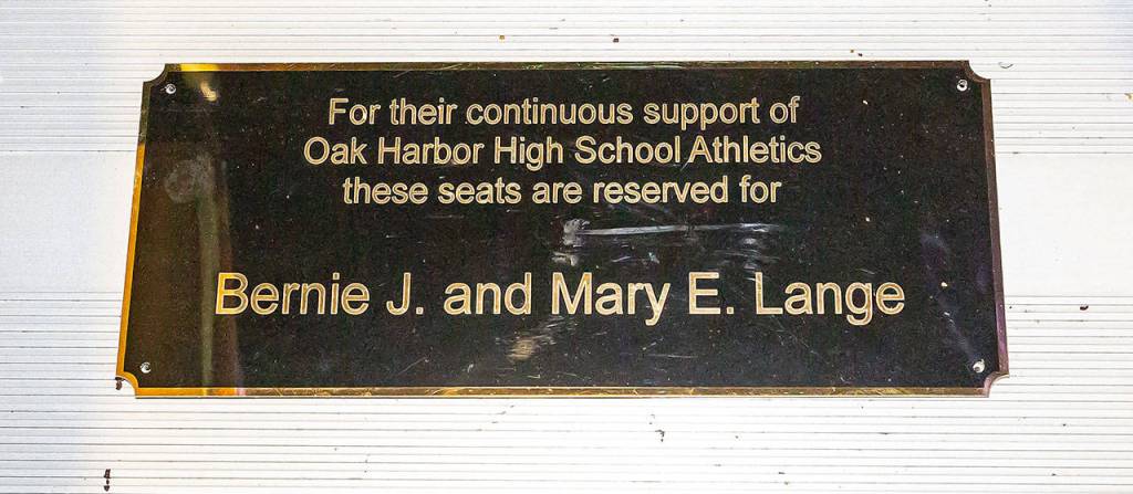 A plaque has been placed at Wildcat Memorial Stadium reserving the seats of longtime fans Bernie and Mary Lange. The Langes have attended nearly 700 Oak Harbor football games since the 1940s.