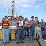 Photo provided                                The Shifty Sailors play at the Tall Ship Festival in Riga, Latvia in 2003 aboard the German sailing vessel Seute Deern. Pictured are Jim Amis, Mike Thelen, Wylie Vracin, Karl Olsen, Clarke Harvey, Vern Olsen (accordion), Ray Loe, Bruce Bardwell, Denny Armstrong (guitar), Jack Moeller and Peter Lawl.