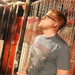 Volunteer Caleb Gremmel stands in the Sinister room in the basement of the Roller Barn. Each room is inspired by famously scary movies. Photo by Laura Guido/Whidbey News-Times