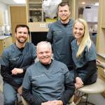 Doug Wirth, center, and his sons Jared, left, and Derek all practice dentistry together with Dereks wife Hope Wirth. Photo by Laura Guido/Whidbey News-Times
