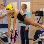 Caitlin Dennen takes off aganst Lake Stevens and Glacier Peak.(Photo by John Fisken)