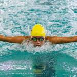 Frances Empinado swims a leg for the Wildcat medley relay team. (Photo by John Fisken)
